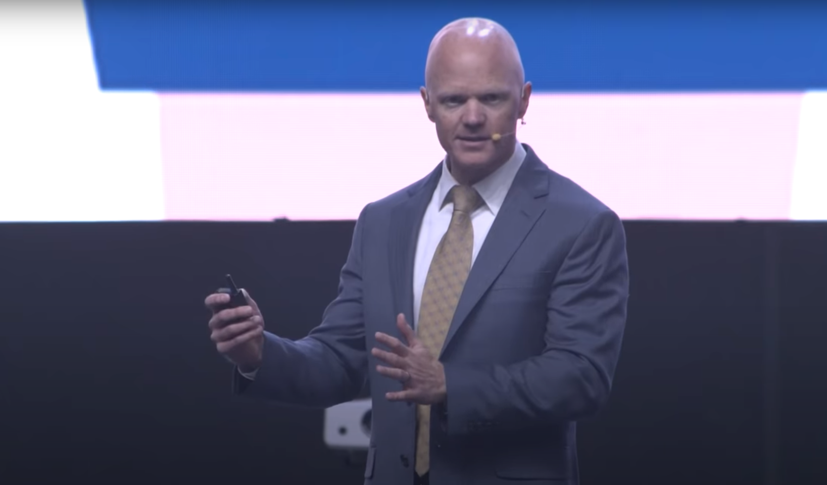 Photo of a speaker on a stage