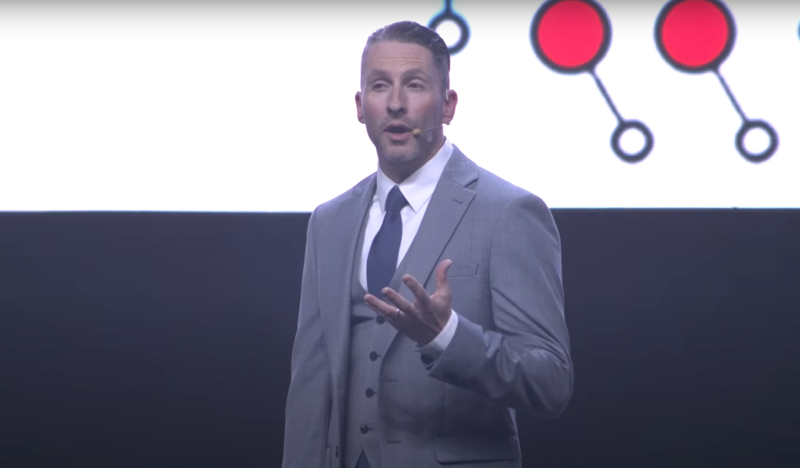 Photo of a speaker on a stage